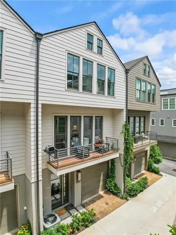 a front view of a house with outdoor seating