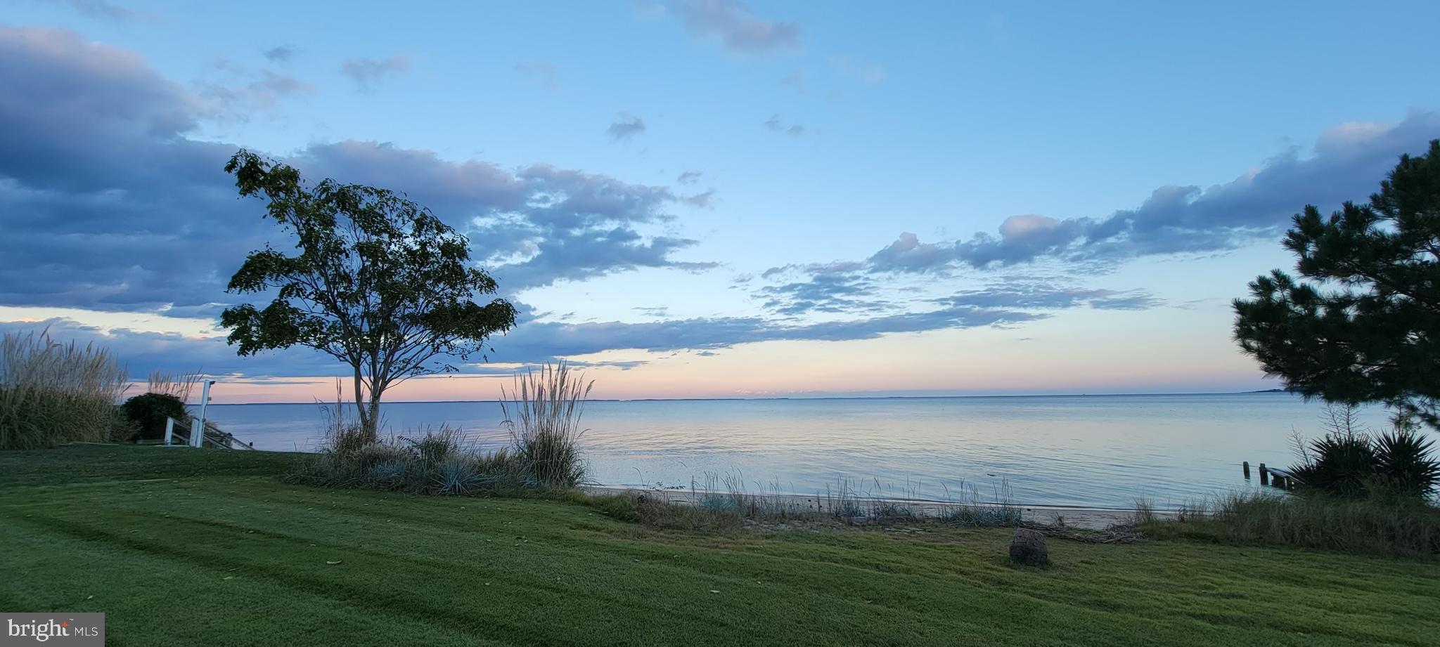 12880 Bay Drive Lusby, MD 20657 - Photo 3 of 9 a view of a lake with a big yard