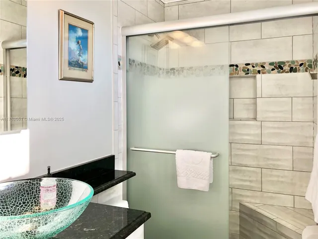 a bathroom with a tub and shower