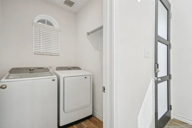 a utility room with dryer and washer