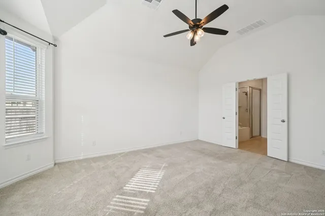 a view of an empty room with a window