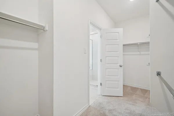 a view of an empty walk in closet