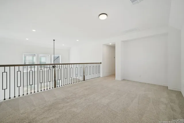 a view of an empty room with stairs