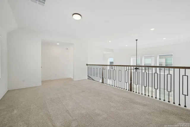 a view of an empty room with stairs