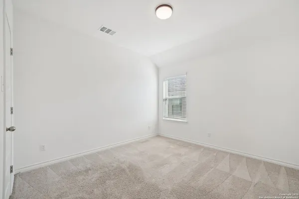 a view of empty room with windows