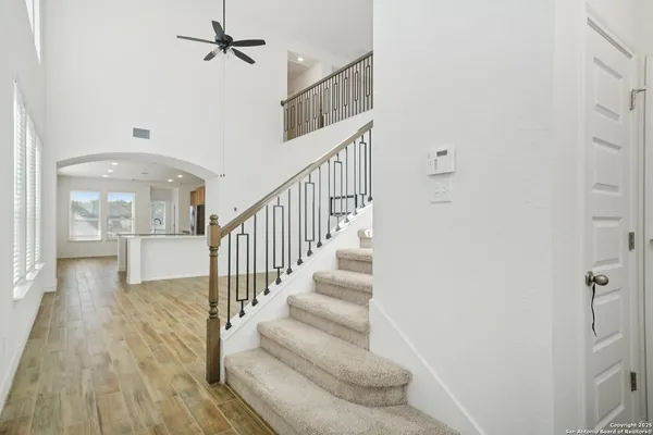 a view of entryway and hall with wooden floor