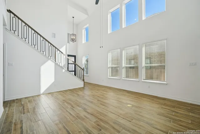 a view of an entryway with wooden floor