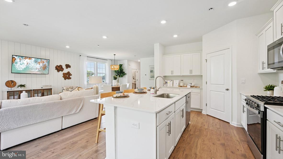 505 Scotty Boulevard, Unit 1302 Rio Grande, NJ 08242 - Photo 21 of 55 a open kitchen with stainless steel appliances granite countertop a lot of counter space and wooden floors