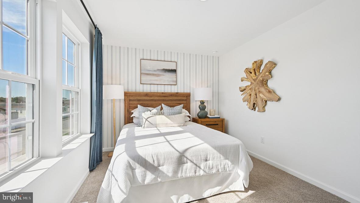 505 Scotty Boulevard, Unit 1302 Rio Grande, NJ 08242 - Photo 36 of 55 a bedroom with a bed and a painting on the wall