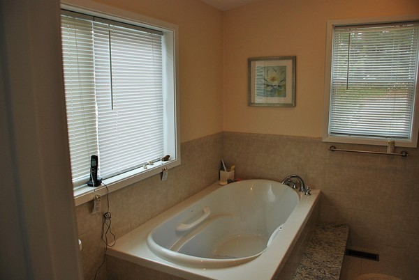 28 Patterson Road Lexington, MA 02421 - Photo 6 of 6 a bathroom with a bathtub and a window