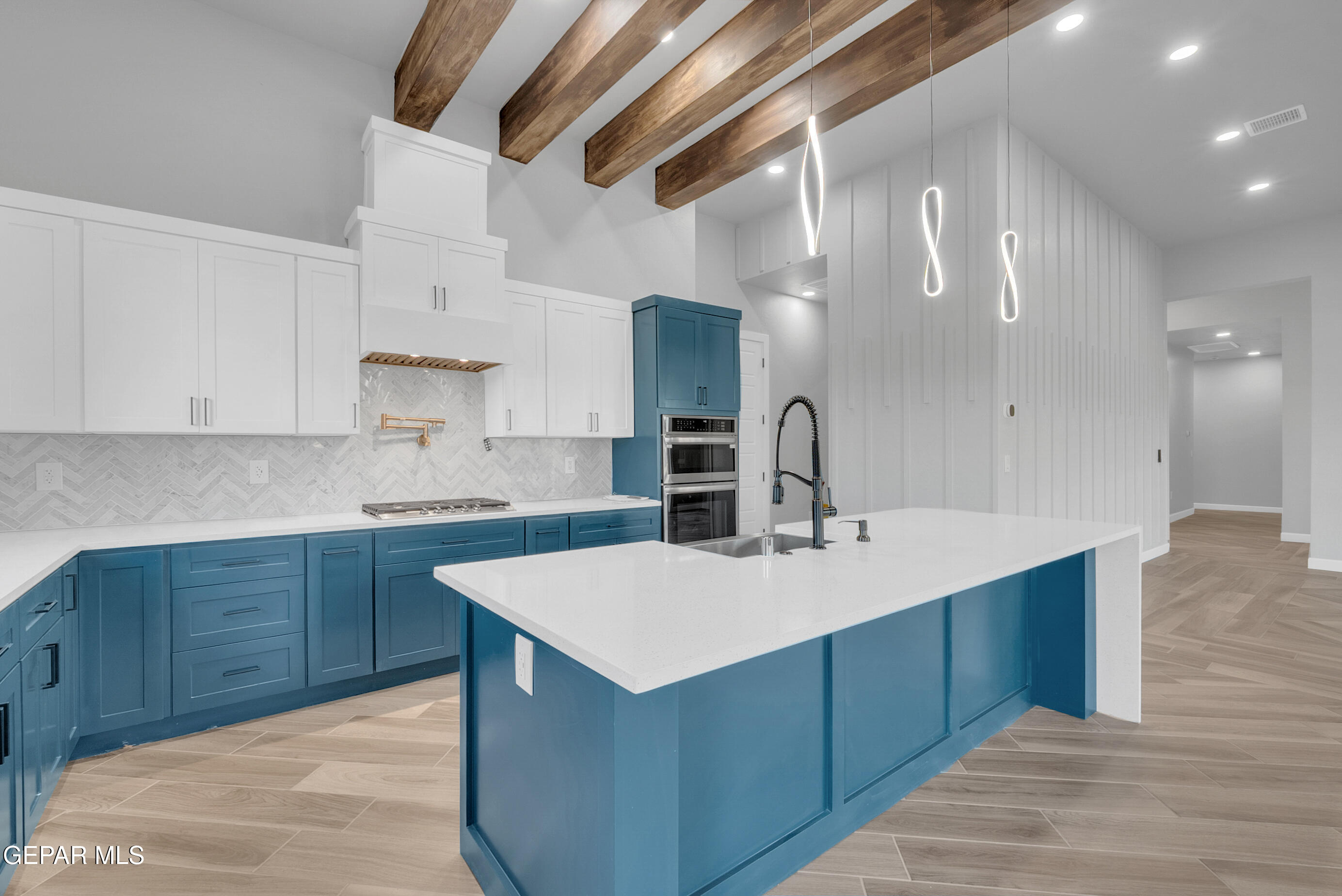 5612 Rio Bonito Circle El Paso, TX 79932 - Photo 27 of 79 a kitchen with a sink cabinets and wooden floor