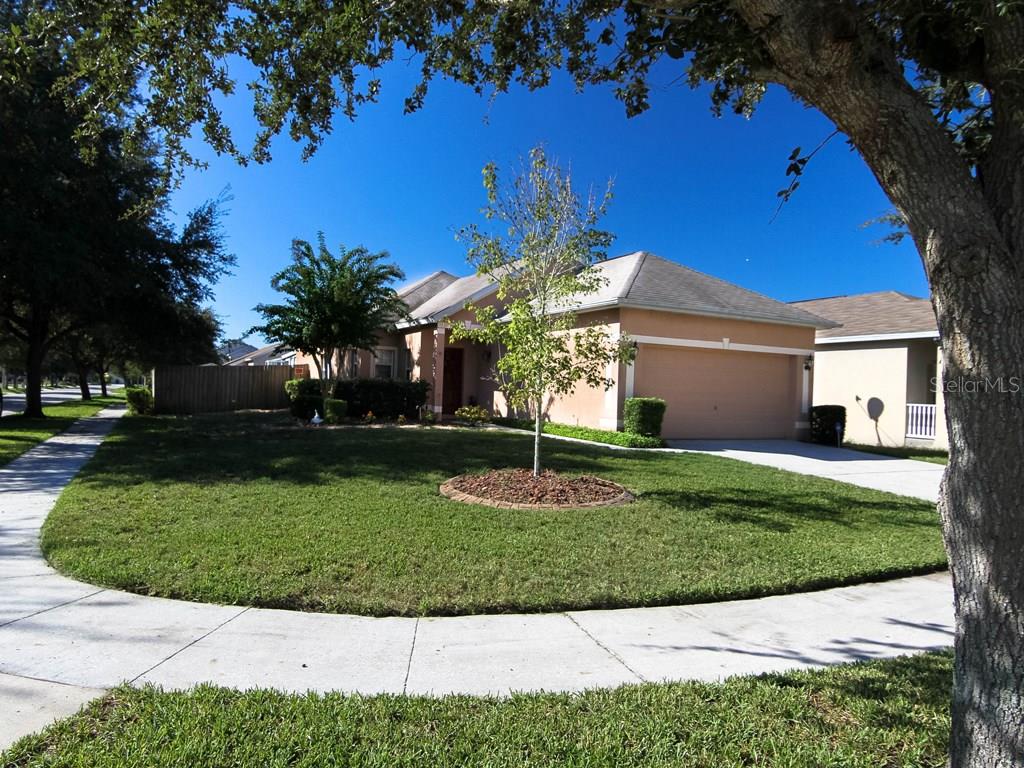 7633 Devonbridge Garden Way Apollo Beach, FL 33572 - Photo 1 of 1 a view of a house with a yard