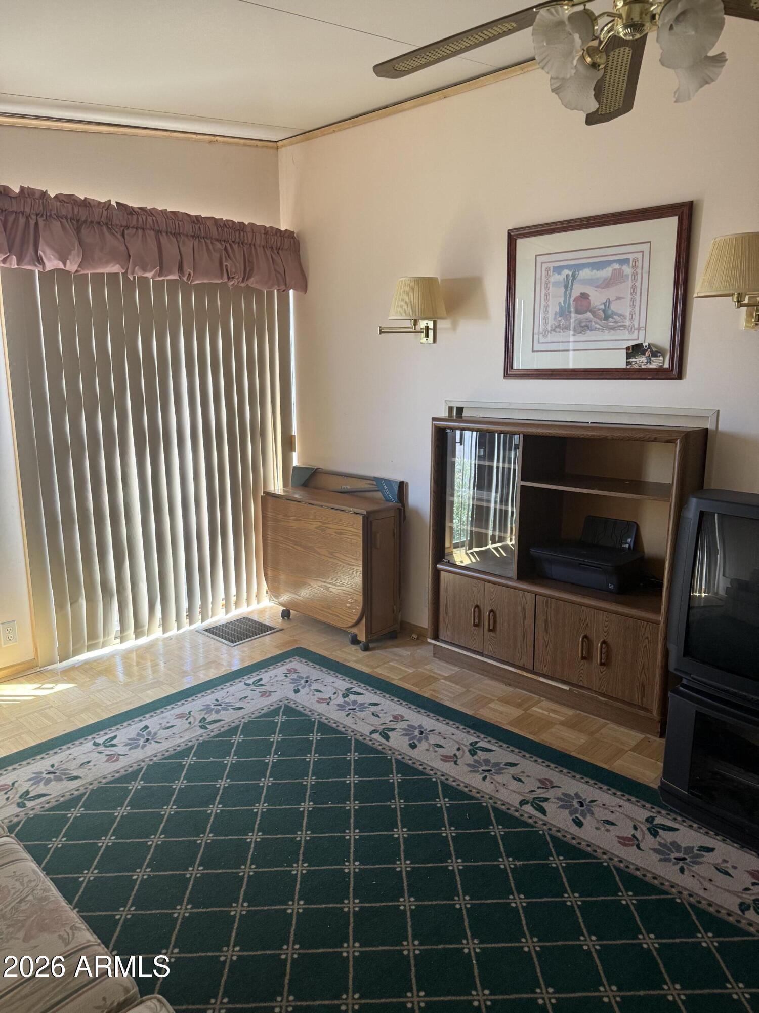 7750 East Broadway Road, Unit 406 Mesa, AZ 85208 - Photo 14 of 36 a view of a living room and a window