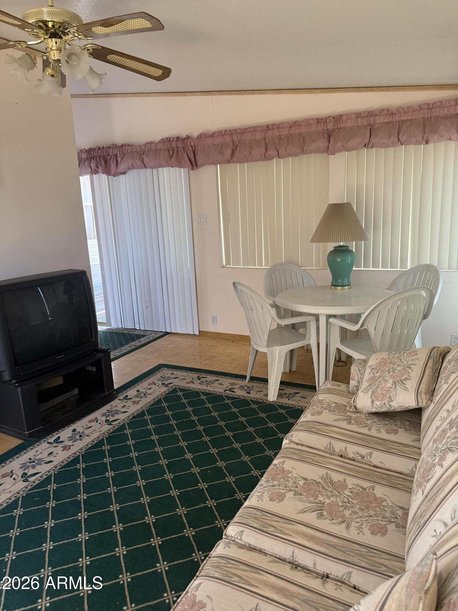 7750 East Broadway Road, Unit 406 Mesa, AZ 85208 - Photo 15 of 36 a living room with furniture