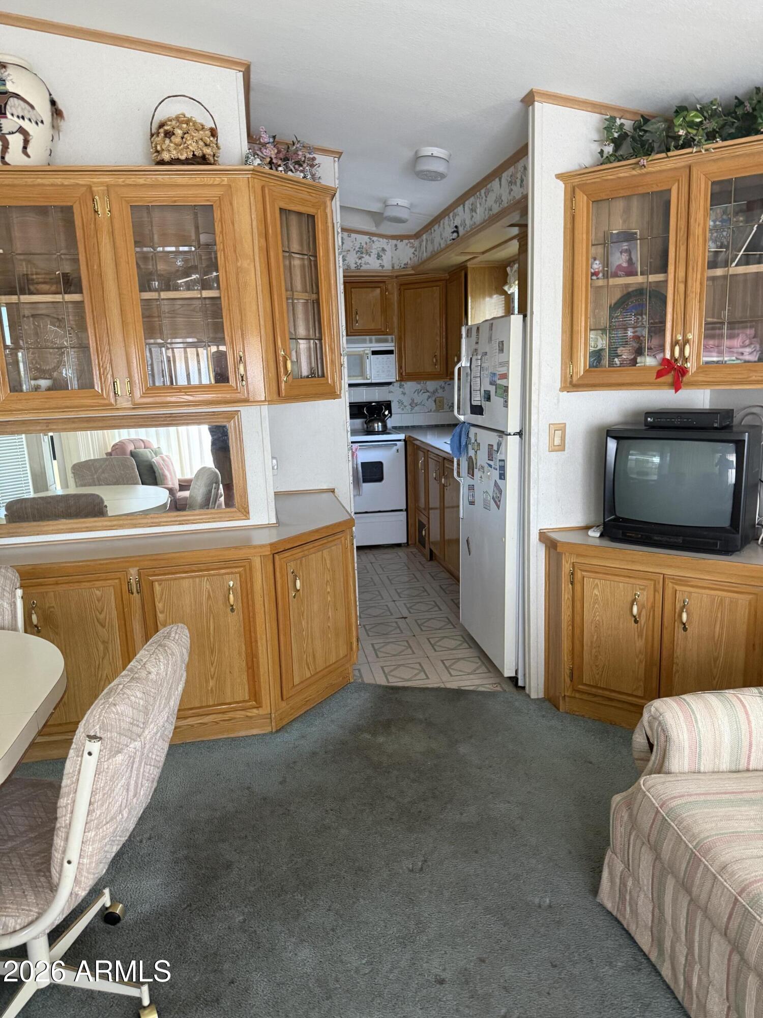7750 East Broadway Road, Unit 406 Mesa, AZ 85208 - Photo 5 of 36 a living room with furniture and a flat screen tv