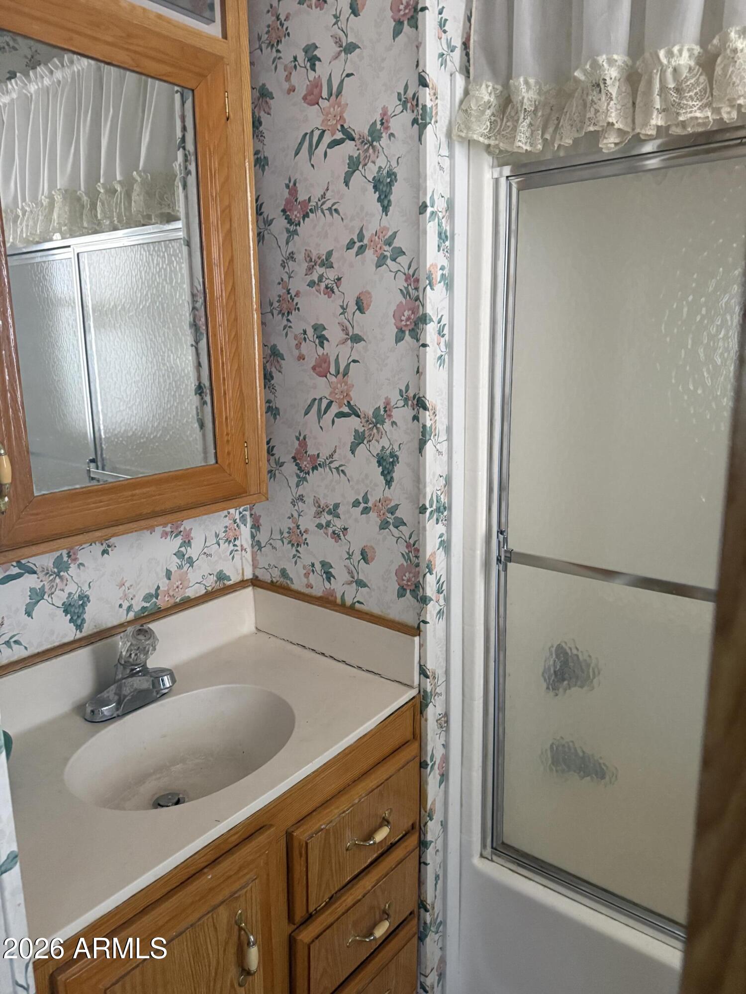 7750 East Broadway Road, Unit 406 Mesa, AZ 85208 - Photo 9 of 36 a bathroom with a sink and a mirror