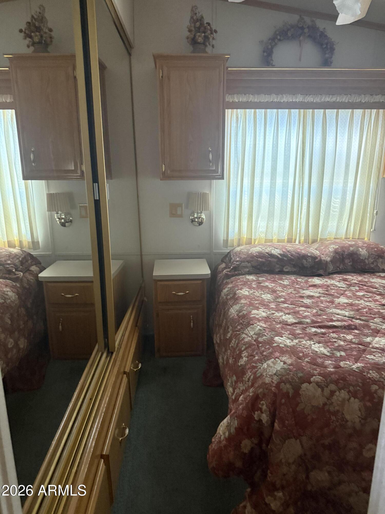 7750 East Broadway Road, Unit 406 Mesa, AZ 85208 - Photo 10 of 36 a bedroom with a bed and a window