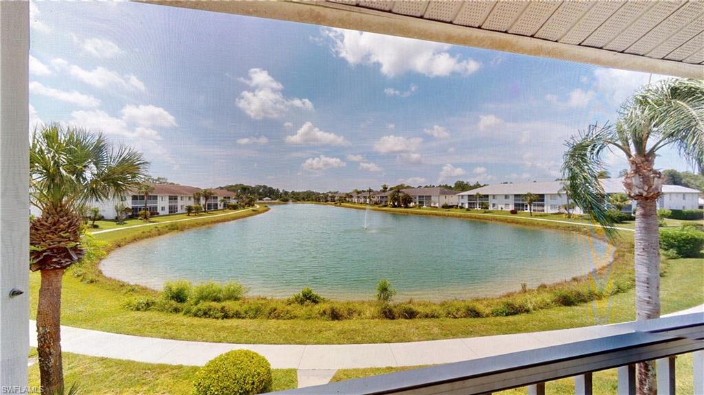 a view of a swimming pool with a lake from a balcony