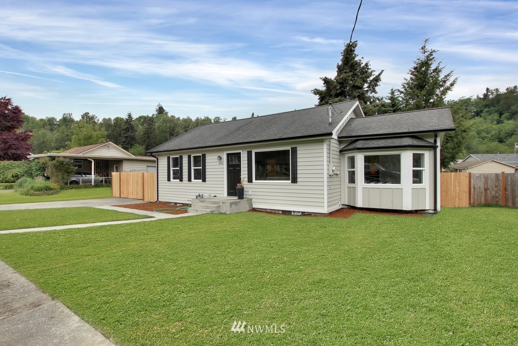 3116 Southeast 6th Street Renton, WA 98058 - Photo 1 of 20 a front view of a house with a garden