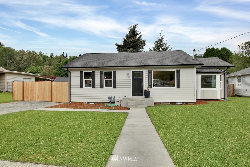 3116 Southeast 6th Street Renton, WA 98058 - Photo 2 of 20 a front view of house with yard and green space