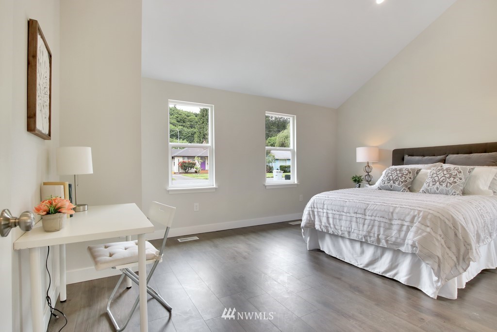 3116 Southeast 6th Street Renton, WA 98058 - Photo 13 of 20 a bedroom with a bed and a table in it with window