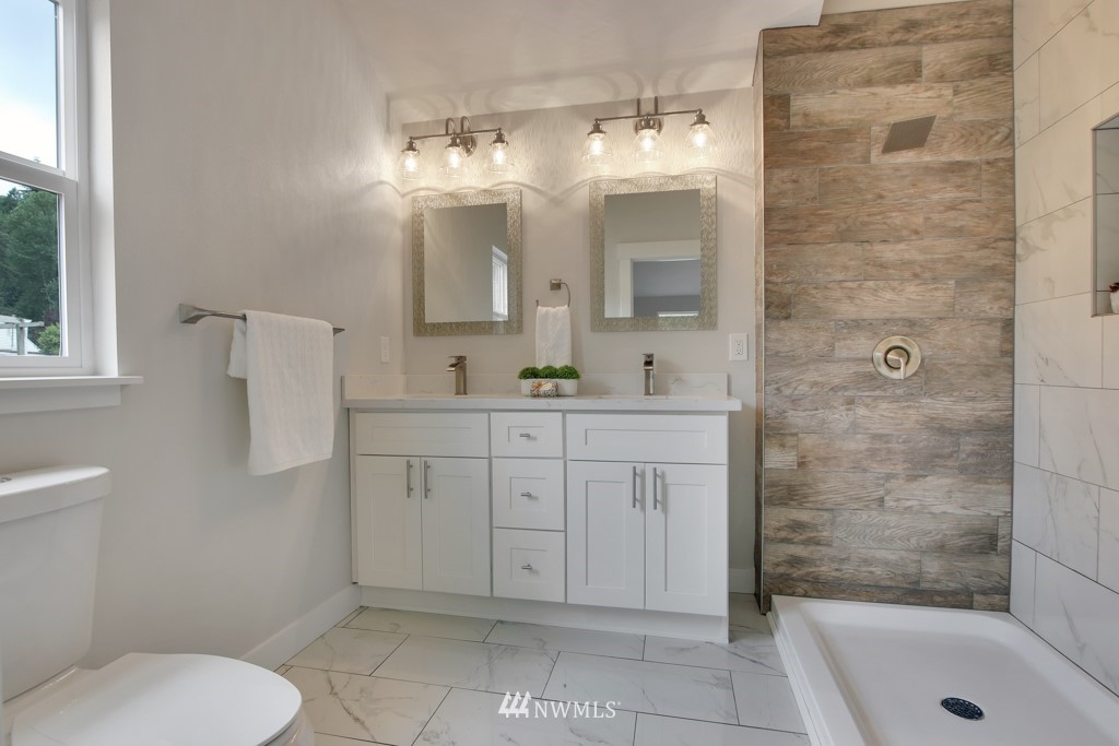 3116 Southeast 6th Street Renton, WA 98058 - Photo 14 of 20 a bathroom with a sink a toilet and shower