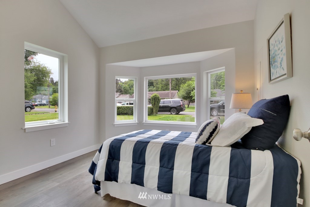 3116 Southeast 6th Street Renton, WA 98058 - Photo 16 of 20 a bedroom with a bed and window