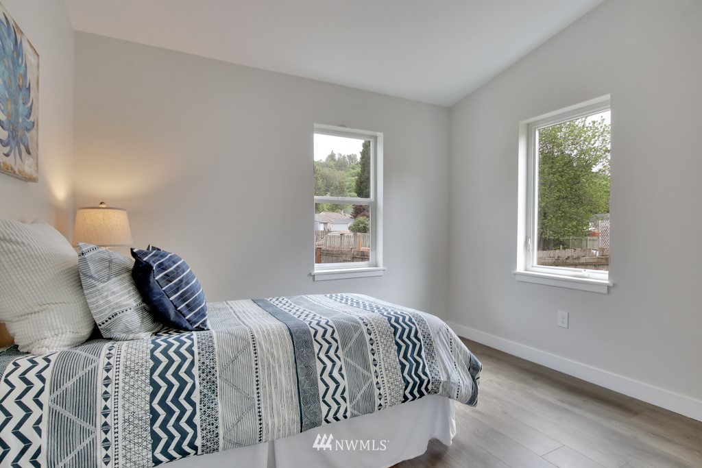 3116 Southeast 6th Street Renton, WA 98058 - Photo 17 of 20 a bedroom with a bed and window