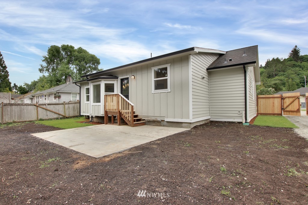 3116 Southeast 6th Street Renton, WA 98058 - Photo 19 of 20 a view of a house with backyard and trees
