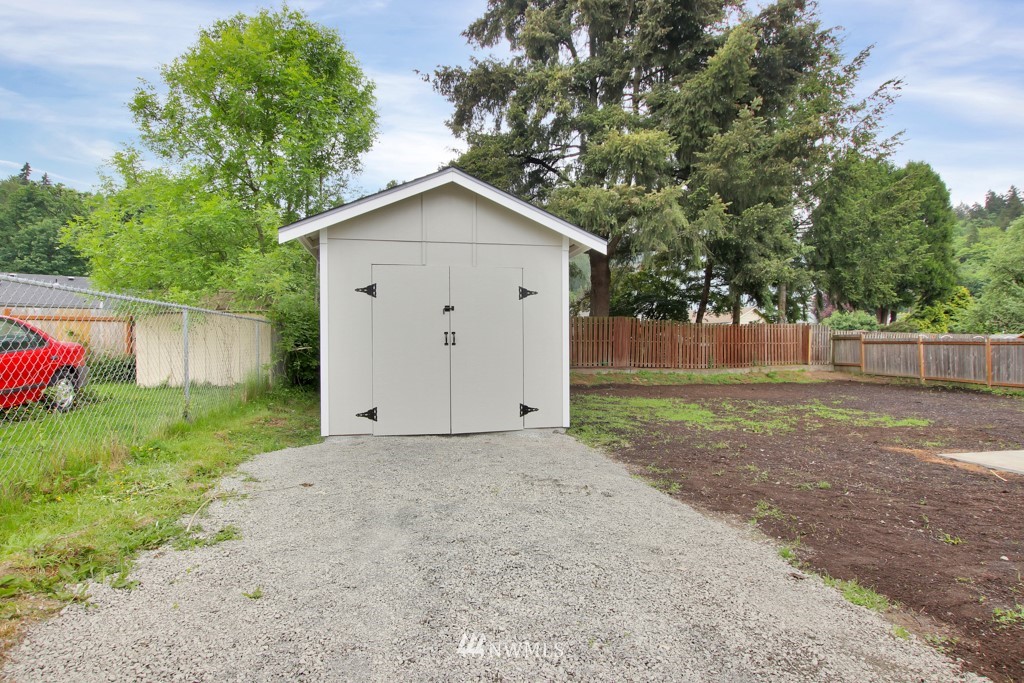 3116 Southeast 6th Street Renton, WA 98058 - Photo 20 of 20 a view of white house with a yard and a large tree