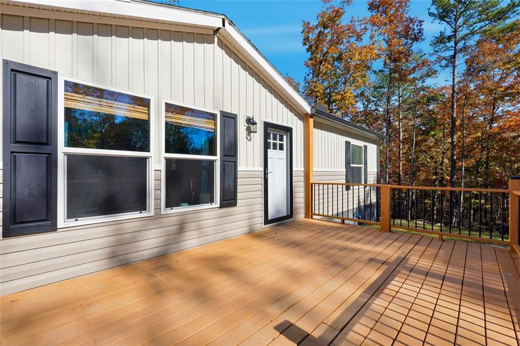 158 Woodsmoke Road Rockmart, GA 30153 - Photo 3 of 25 a view of backyard with large trees and wooden fence