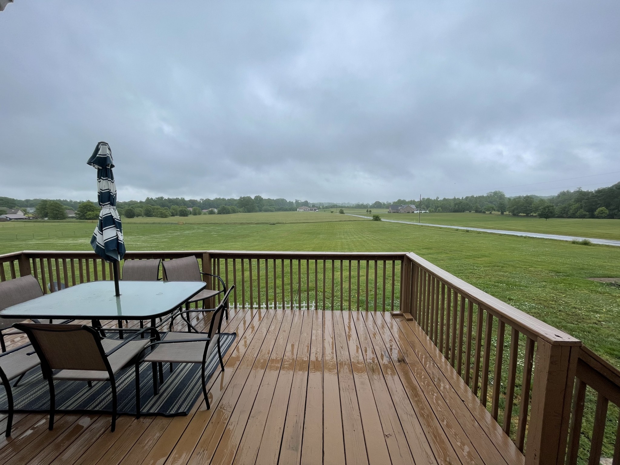 5235 Youngville Road Springfield, TN 37172 - Photo 6 of 28 a view of a table and chairs on the roof deck