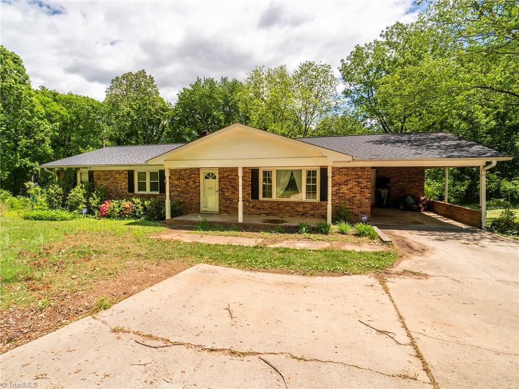 5531 Davis Road Walkertown, NC 27051 - Photo 1 of 30 Front of the house, paved driveway, covered porch, single car carport.