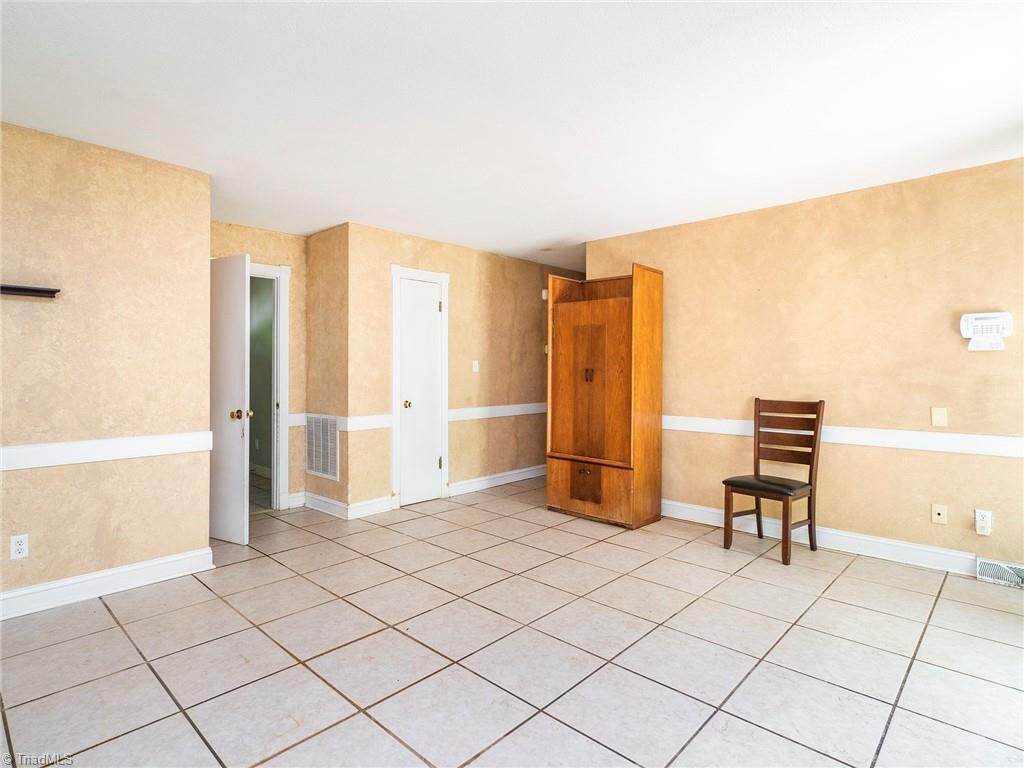 5531 Davis Road Walkertown, NC 27051 - Photo 14 of 30 Den with hallway to the the bedrooms and access to foyer