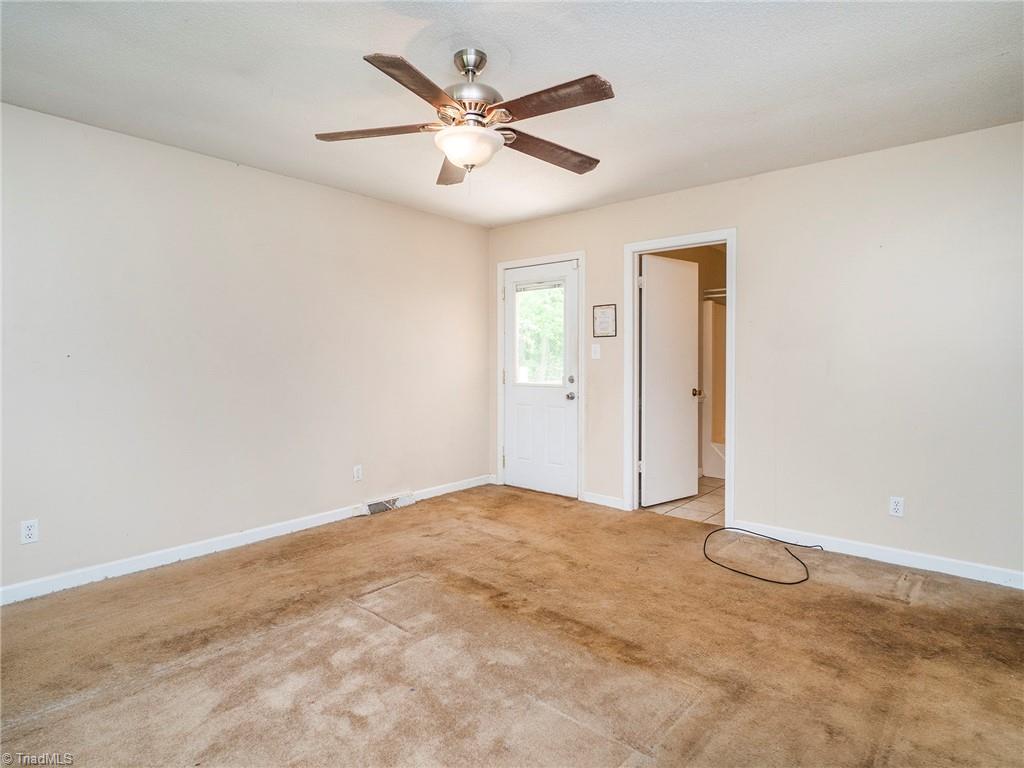 5531 Davis Road Walkertown, NC 27051 - Photo 16 of 30 Primary room with door to the deck and private bathroom