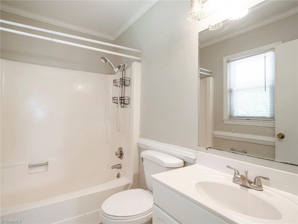5531 Davis Road Walkertown, NC 27051 - Photo 17 of 30 Primary private bathroom with shower/tub combo and single bowl vanity