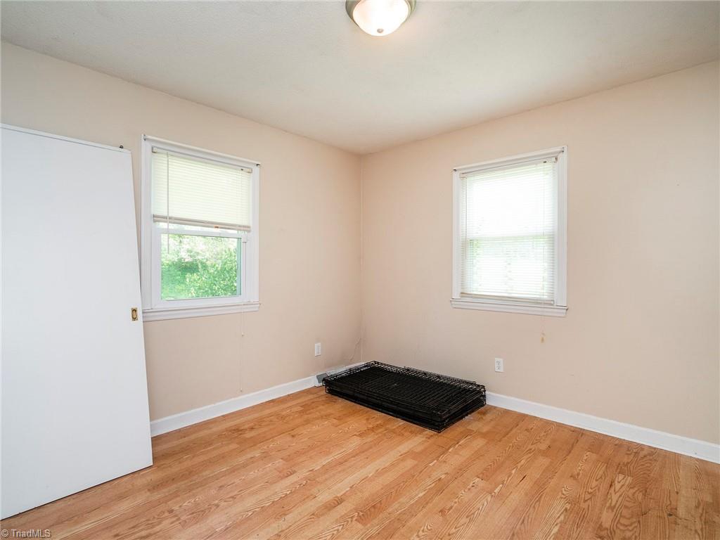 5531 Davis Road Walkertown, NC 27051 - Photo 18 of 30 Bedroom with wood floors and overlooking the front yard
