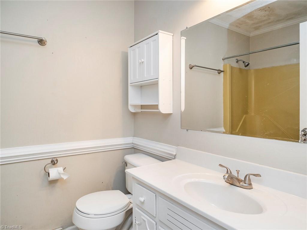 5531 Davis Road Walkertown, NC 27051 - Photo 19 of 30 Full bathroom in the hallway with shower/tub combo and single bowl vanity