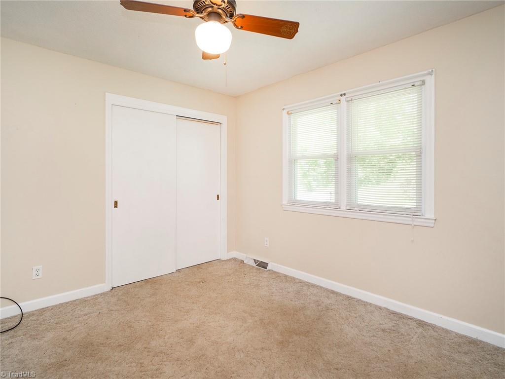 5531 Davis Road Walkertown, NC 27051 - Photo 20 of 30 Carpeted bedroom overlooking front yard with closet