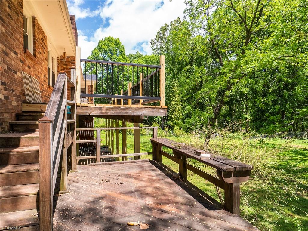 5531 Davis Road Walkertown, NC 27051 - Photo 27 of 30 Stairs from deck leading to fenced in backyard