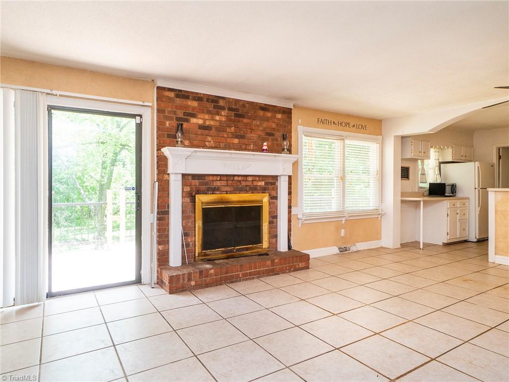 5531 Davis Road Walkertown, NC 27051 - Photo 5 of 30 Den with fireplace, has sliding glass door to deck