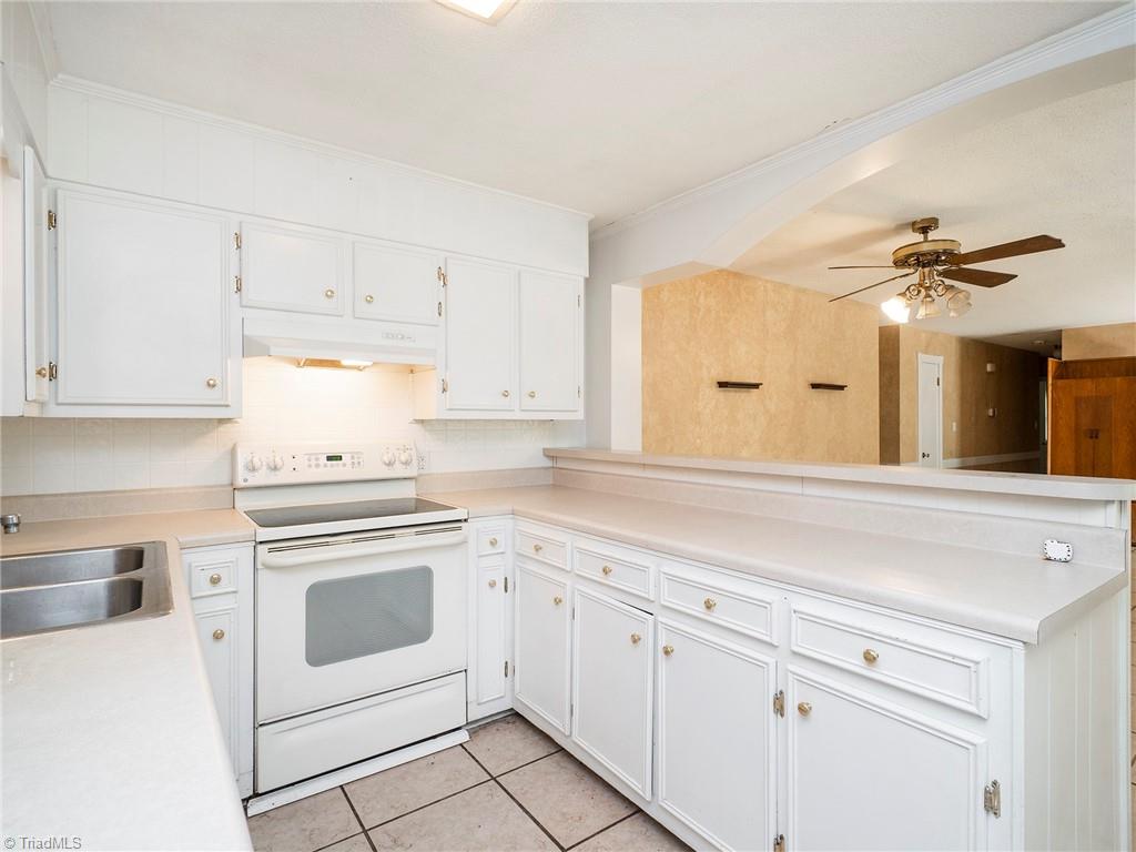 5531 Davis Road Walkertown, NC 27051 - Photo 6 of 30 Kitchen with ample counter space, dishwasher, and slide in range