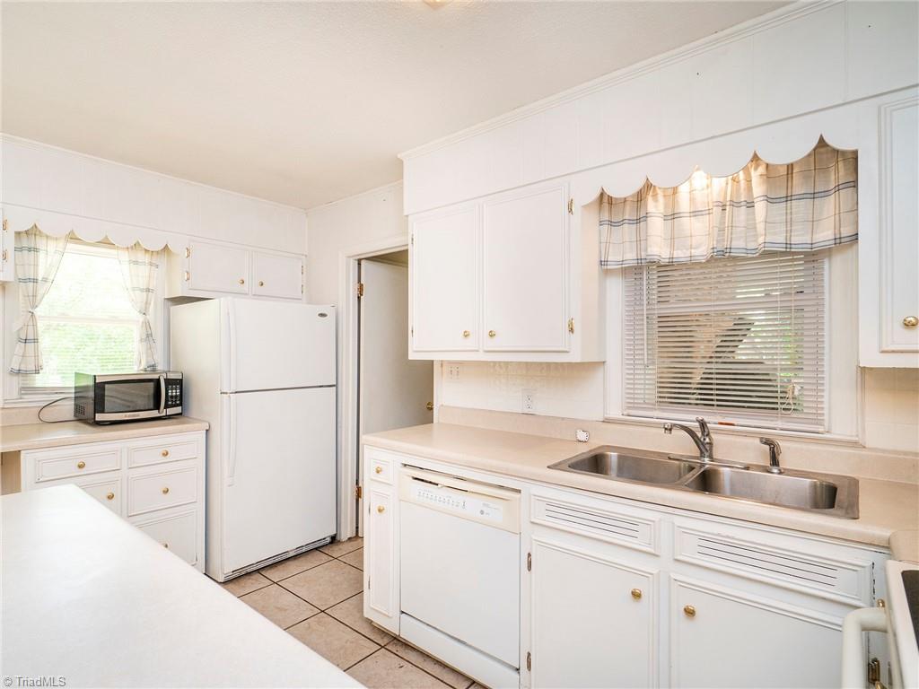 5531 Davis Road Walkertown, NC 27051 - Photo 10 of 30 Kitchen with doorway to the laundry room