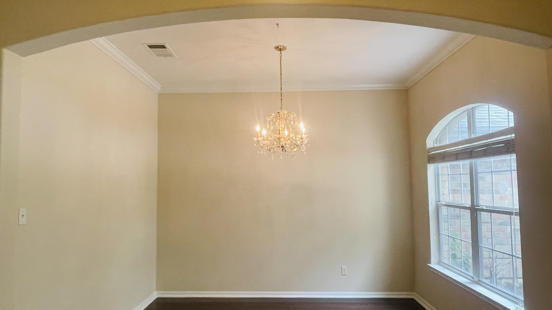 6805 Cromarty Lane Austin, TX 78754 - Photo 3 of 18 a view of a hallway with windows and chandelier