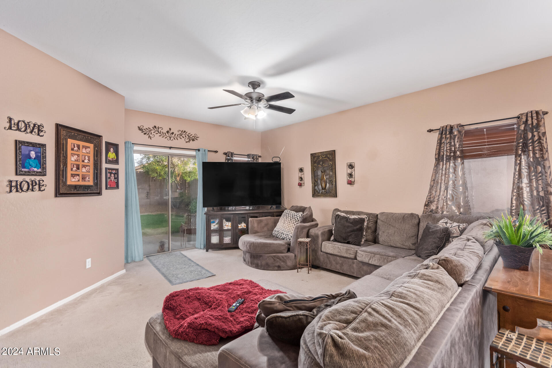321 East Cheyenne Road San Tan Valley, AZ 85143 - Photo 11 of 33 a living room with furniture and a flat screen tv