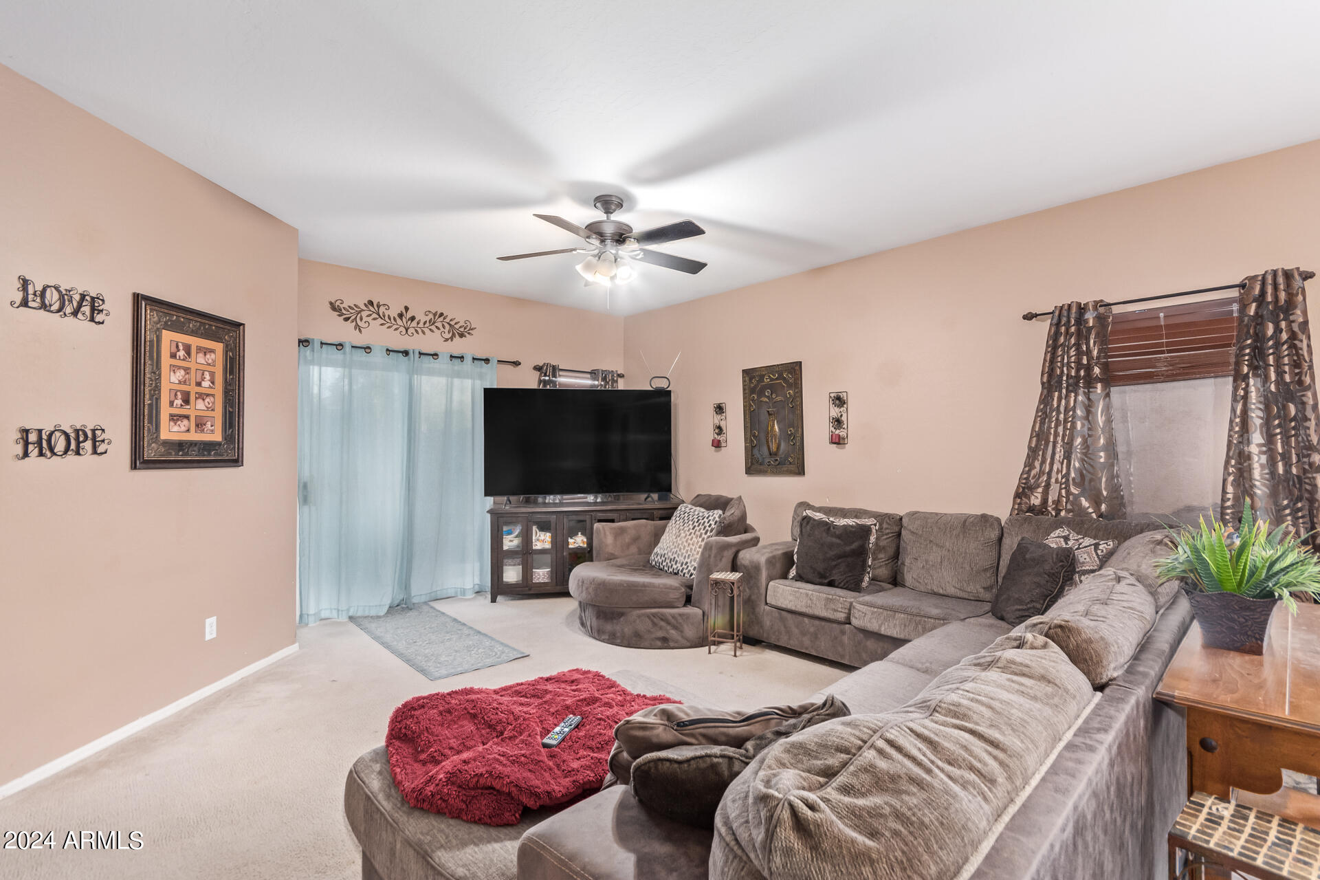 321 East Cheyenne Road San Tan Valley, AZ 85143 - Photo 12 of 33 a living room with furniture and a flat screen tv