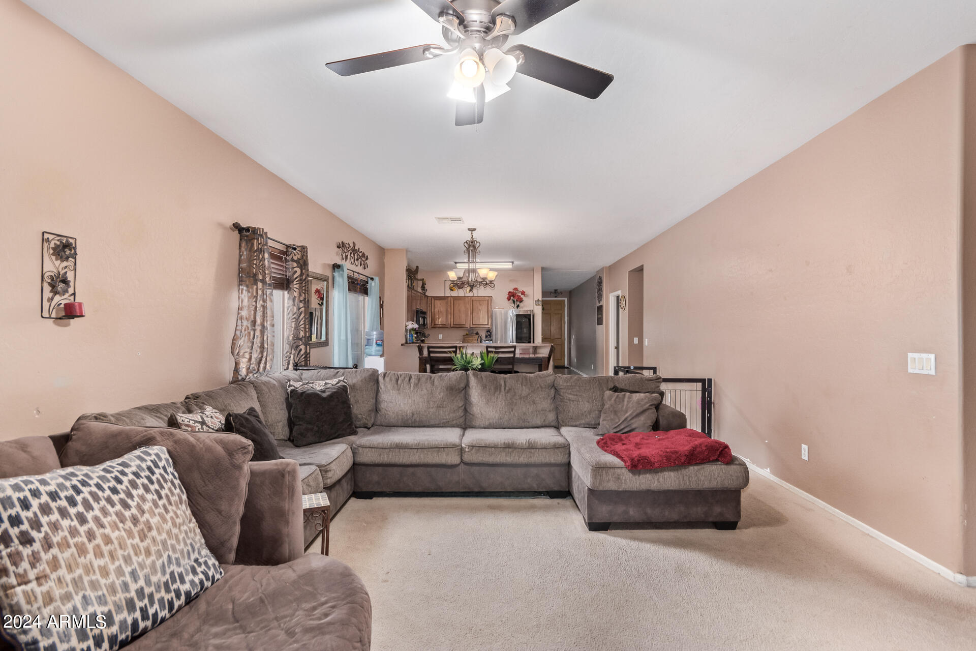 321 East Cheyenne Road San Tan Valley, AZ 85143 - Photo 14 of 33 a living room with furniture and a chandelier