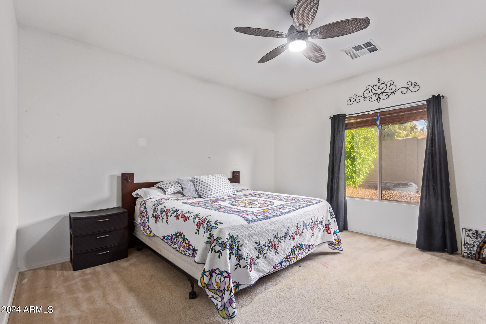 321 East Cheyenne Road San Tan Valley, AZ 85143 - Photo 21 of 33 a bedroom with a bed and a large window