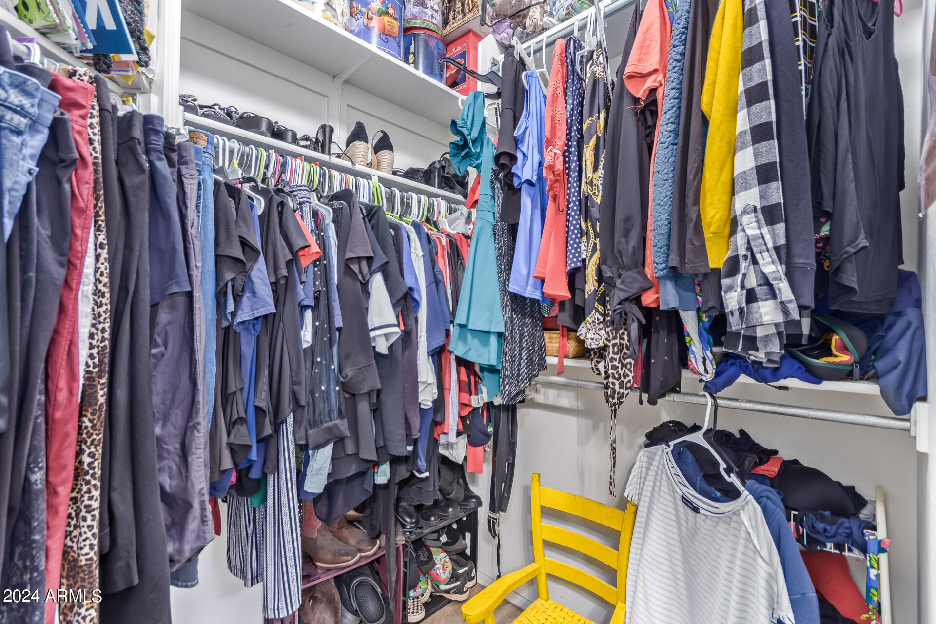 321 East Cheyenne Road San Tan Valley, AZ 85143 - Photo 24 of 33 a view of walk in closet with clothes and shoes