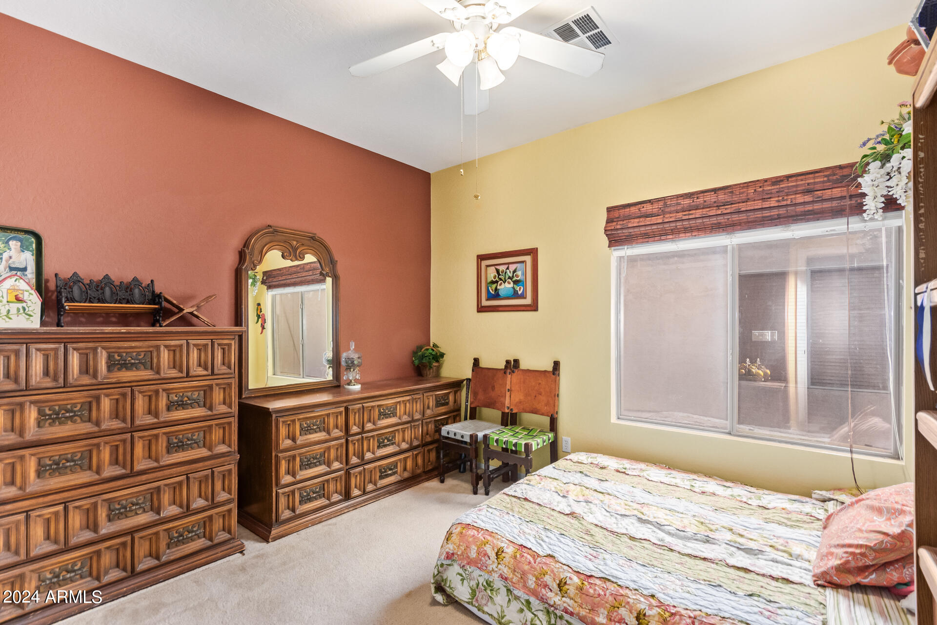 321 East Cheyenne Road San Tan Valley, AZ 85143 - Photo 25 of 33 a bedroom with a bed and a chandelier
